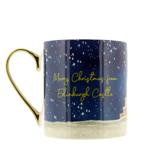 A ceramic Christmas mug with a gold handle, featuring a dark blue night sky design with white stars, gold cursive text reading 'Merry Christmas from Edinburgh Castle', and a snowy landscape at the base. - Image
