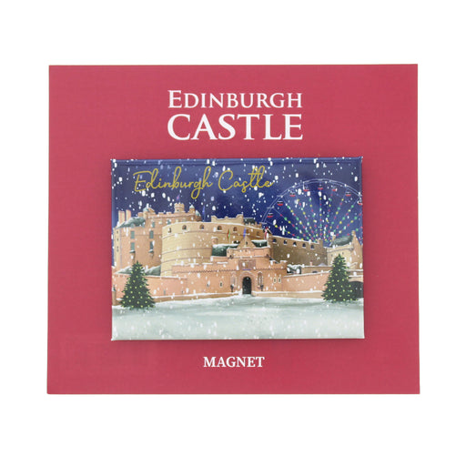 An Edinburgh Castle themed refrigerator magnet displayed on its red backing card, which features the text 'EDINBURGH CASTLE' and 'MAGNET'. The magnet itself depicts a snowy night scene of the castle with a Ferris wheel. - Image