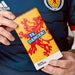 Person holding a 'YA DANCER!' chocolate bar with a lion design on a blue background - Image