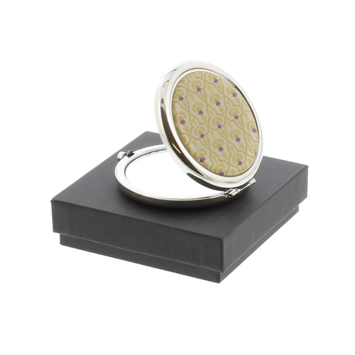 thistle compact mirror shown open sitting on top of black square gift box