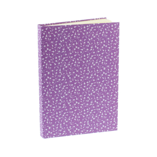 purple coloured hardback notebook with repeat tulip pattern design shown upright at an angle with pages slightly shown at top