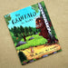 Book cover of 'The Gruffalo' with a forest scene and Gruffalo character on a beige background - Image
