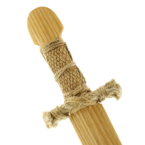 close up detail of wooden toy sword handle showing wrapped string hilt