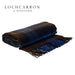 buchanan blue tartan wool throw shown folded with lochcarron logo in top left corner of image