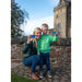 The Historic Scotland Membership is held up by a person and a young child on the path to one of the Castle sites. 
