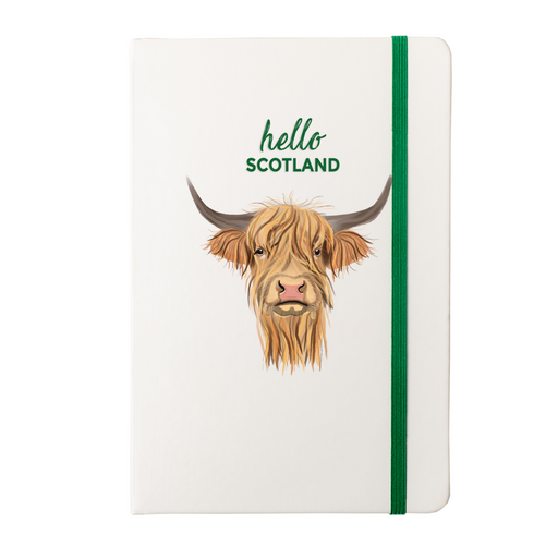 Soft Touch notebook featuring a Highland Cow and the test reads 'hello SCOTLAND'. A green strap closes over the right hand side. 