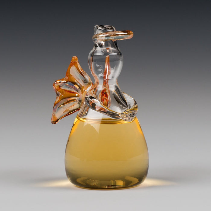 Angels' Share Whisky 25ml. Angel shaped glass containing whisky.