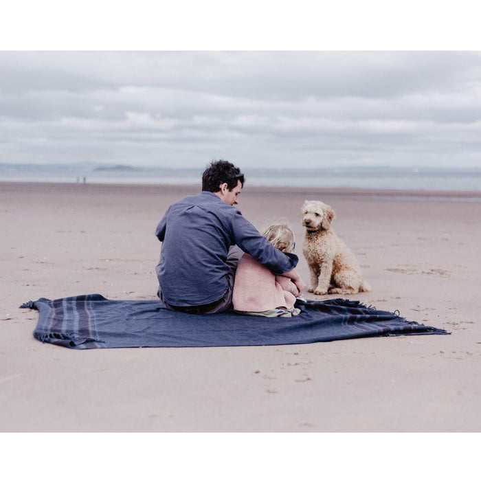 Recycled Wool Knee Blanket in Navy with family on beach