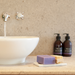 Natural Highland Lavender Soap 140g next to a sink in lifestyle image
