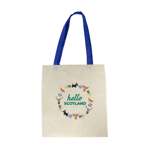 Cotton tote shopper with blue straps features a circular design of scottish icons including the St Andrew's flag, a deer, a scottie dog, a thistle flower, a pheasant and a highland cow. Inside the design are the words 'Hello Scotland' in a green font. 
