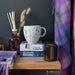 speckled mug sitting on tabletop with other coorie collection items
