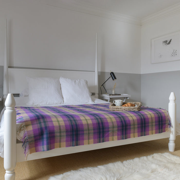 coorie tartan blanket shown on bed full width