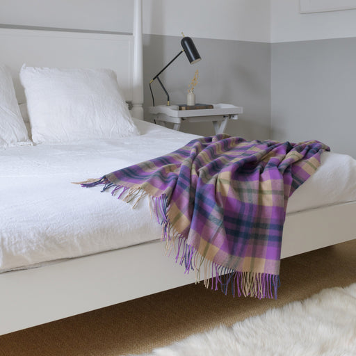 coorie tartan blanket shown on bed