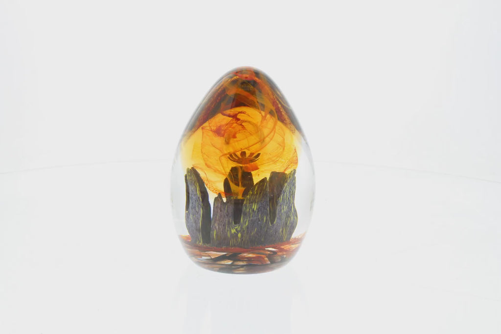 360 rotating view of outlander inspired paperweight made of smooth egg shaped glass with colour inside