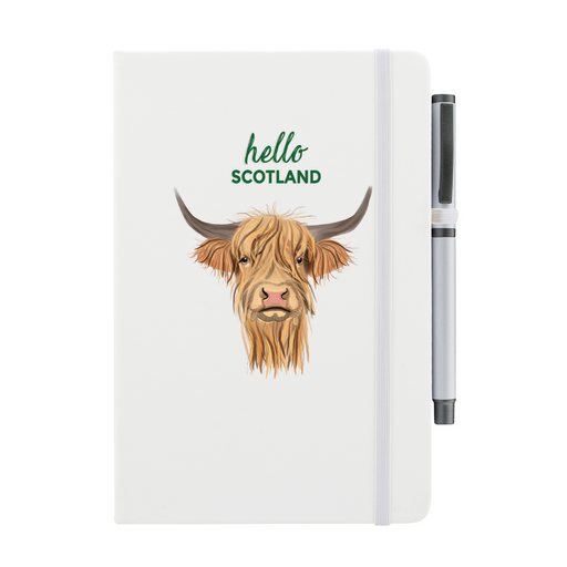 White soft feel note pad with a highland cow motif. the text above reads 'hello SCOTLAND' and comes with a silver pen attached. 