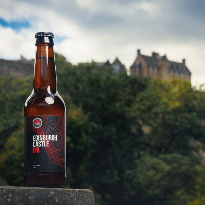 edinburgh castle IPA bottle shown in front of castle