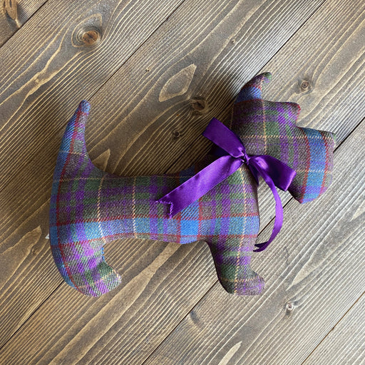 Dog shaped cushion in greyfriars Tartan with bow ribbon bow around neck