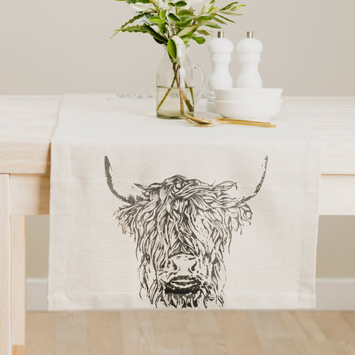 highland cow linen table runner on dining table