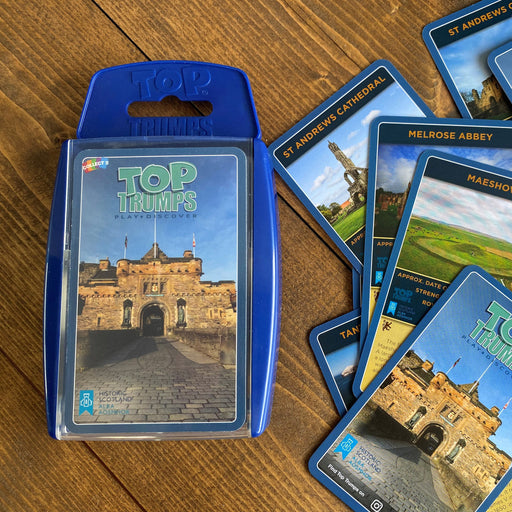 Set of Historic Scotland Top Trumps cards on a table