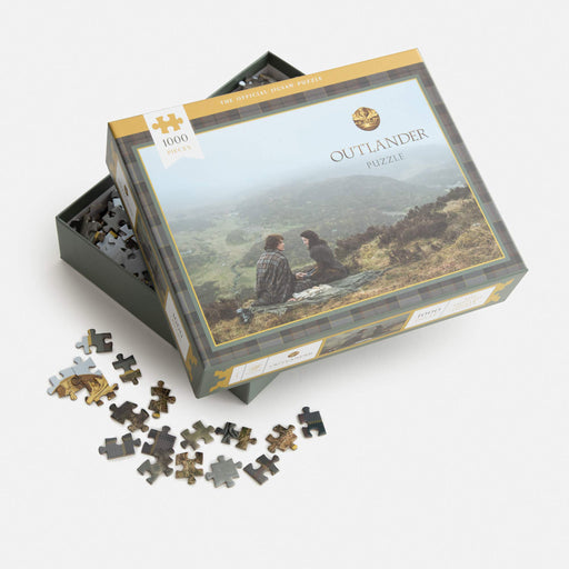 official outlander jigsaw puzzle with open box showing pieces