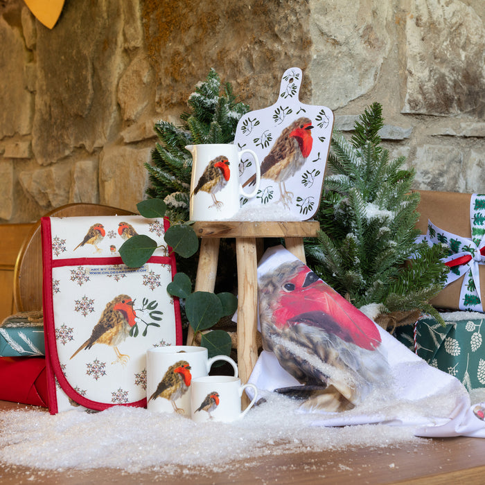 Robin Espresso Mug shown with a selection of christmas robin themed tableware