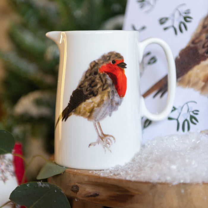 Robin Jug White shown with christmas background in soft focus