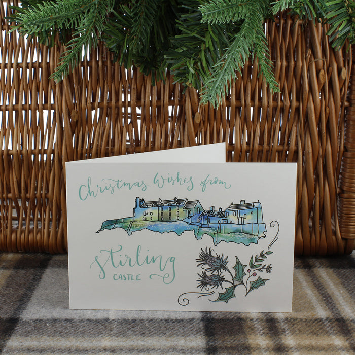 Stirling Castle Christmas Cards shown next to pine branch and hamper